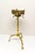 A Victorian era solid brass tea kettle floor stand with burner decorated with fretwork and flour de lis holders. One...