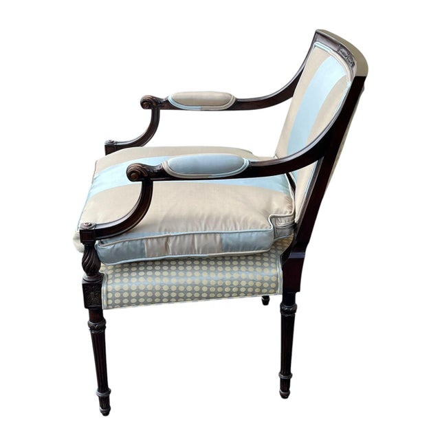 Lovely hand carved mahogany bergere in Louis XVI style. This frame of this fine armchair has numerous neoclassical details...
