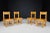 This exquisite set of four solid beechwood chairs was meticulously crafted in France during the 1950s. These pieces are a...