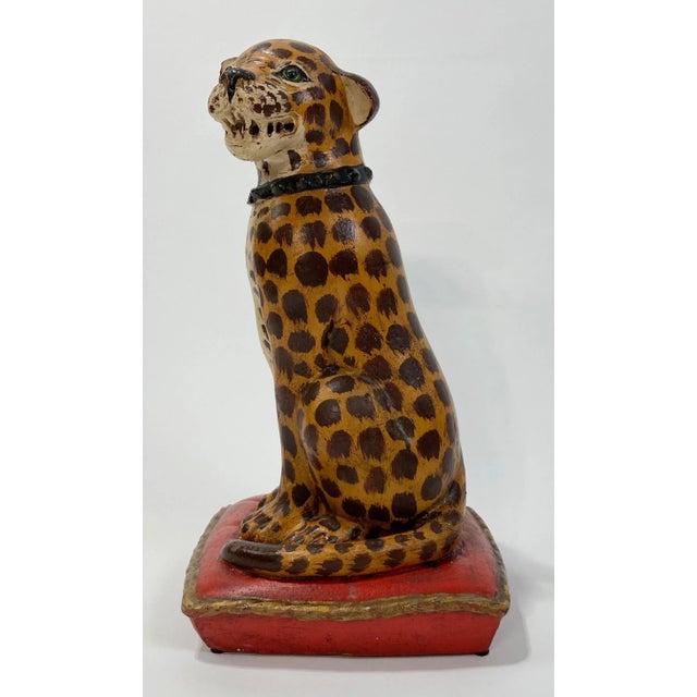 Statuesque handmade ceramic cat seated on red gilded braid pillow. Wonderful hand-painted detail. Unmarked. Hand painted...