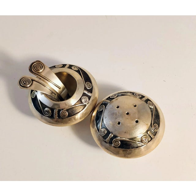 Pair of sterling salt cellar with two spoons and pepper shaker. Not marked but tested Sterling. 1930-50s Has original cork...