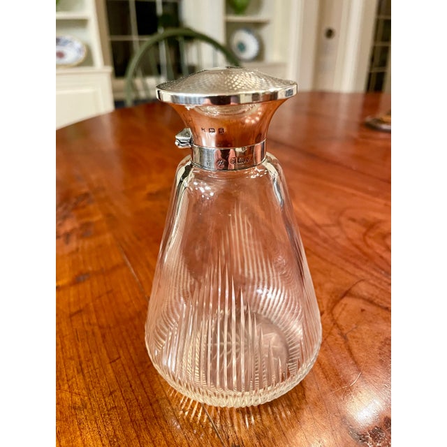 Elevate your dresser or make-up vanity with this elegant glass perfume bottle. Cut glass vessel with star pattern at base....