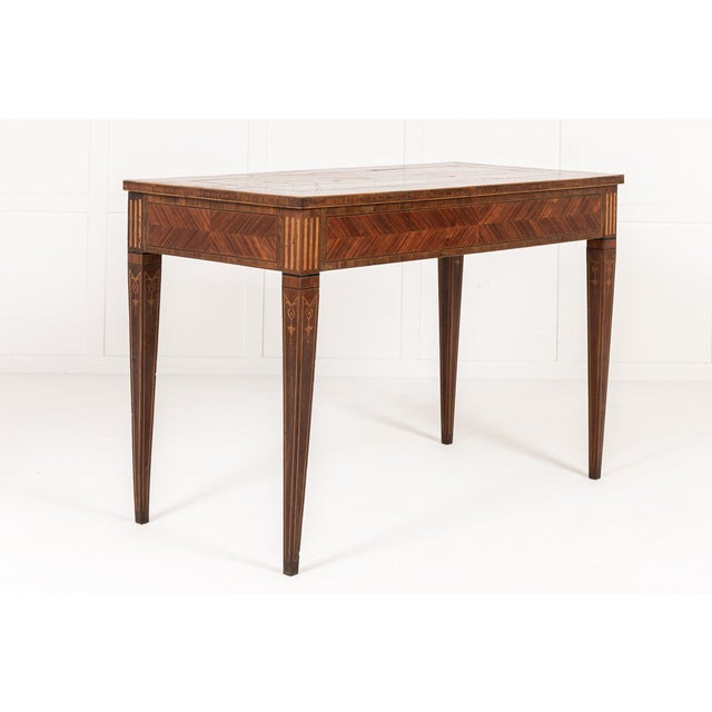 An Elegant Pair of 18th Century Italian Kingwood and Walnut Veneered Console Tables. This elegant pair of Italian console...