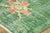 Hand-knotted in wool, this 6x9 vintage Turkish pictorial rug, originating circa 1950-1959, presents a weathered emerald...