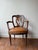 This 19th Century English Armchair features a refined design with clean lines and a sleek leather seat cushion, offering...