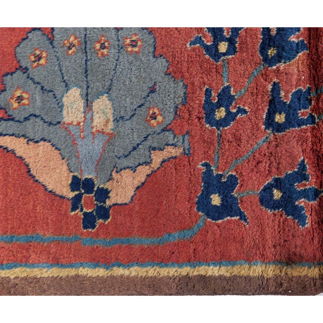 The Antique Colorful Botanic Indian Rug (Size Adjusted), circa 1920, is a remarkable example of early 20th-century Indian...