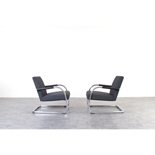 This set of two Visalounge armchairs was designed by the renowned designer Antonio Citterio and manufactured by Vitra....