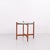 Swedish side table from the 1960s crafted in cherry wood with round glass top. The table features an organic base with...