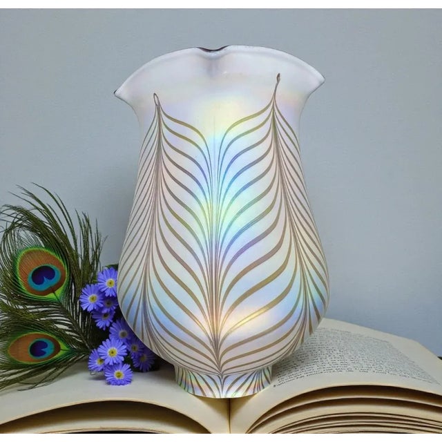 This iridescent pulled feather art glass candle shade is a signed work by Todd Phillips, an American studio glass artist...