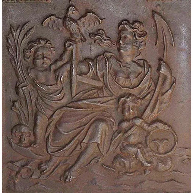Antique late 19th century cast iron arch top fireback with Puti and festoon motifs. Central classical imagery of female...
