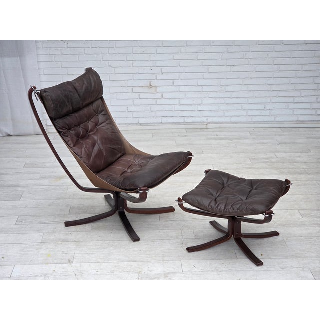 1970s, Norwegian design by Sigurd Ressel, lounge chair with footstool, model "Falcon". Furniture leather, canvas, bent...