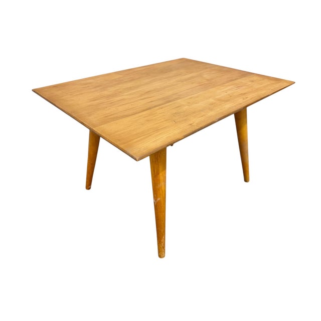 Elevate your space with this authentic Mid-Century Modern Paul McCobb Planner Group solid maple side table, crafted circa...