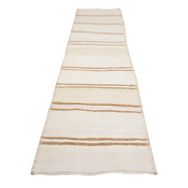 Vintage striped Herki kilim runner from Northern Iraq. Approximately 50-60 years old. In very good condition.