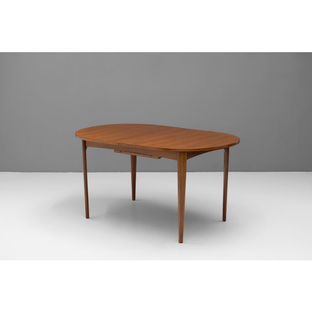 Mid-Century extending teak dining table seating 6-8 people. Re-finished. U.K circa 1960.