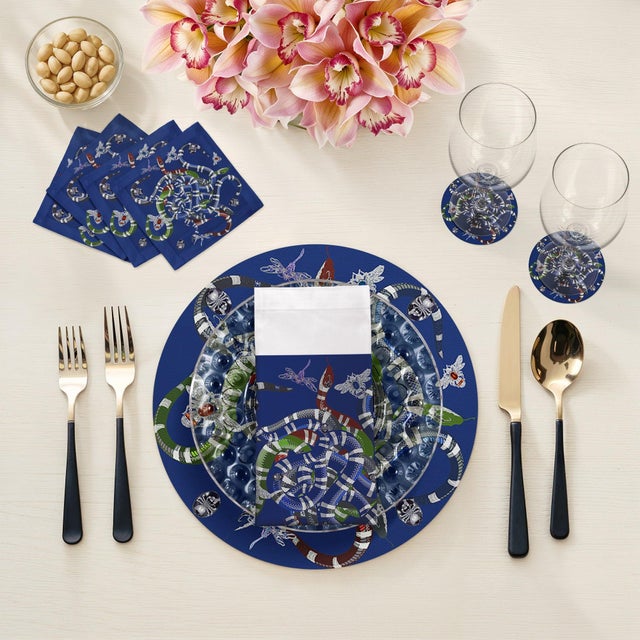 Let your table transition from classic to modern with our Ouroboros Vegan Leather Round Pebble Placemat, featuring an...