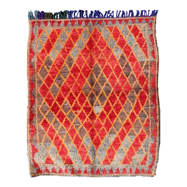 Mid 20th Century Midcentury Moroccan Rug With Orange, Red, Brown Diamonds and Blue Fringe Detail For Sale