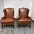 Design Plus Gallery presents a Pair of Bespoke Wingback Armchairs. These armchairs are upholstered in cognac ostrich-...