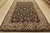 A traditional Agra rug is hand-knotted with fine wool on a cotton foundation. This area rug features a botanical design...