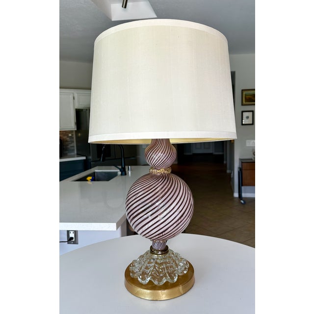 Single Murano lamp by Dino Martens in the "latticino" technique. Swirling glass pattern was created by swirl patterns of...