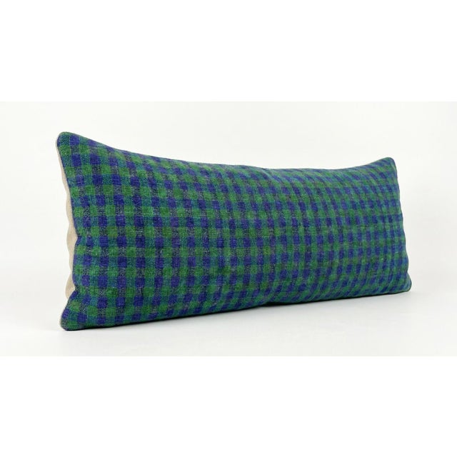 This beautiful 16'' x 49'' pillow cover was made from an authentic Turkish rug. Bright colors of wool adorn the front of...