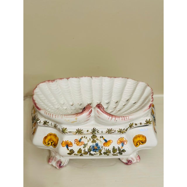 A delightful vintage Italian majolica berry server featuring a removable shell-form strainer nestled into a matching...