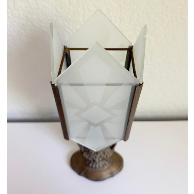 Stunning vintage 1930's Art Deco table lamp featuring a diamond-shaped, etched glass shade, framed in bronze metal. The...