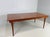 This extendable table designed by Finn Juhl is made of solid teak and combines elegant lines with practical functionality....