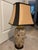 Offering a lovely gold and black patterned ceramic lamp with Asian brass finial. Included is a black and gold bell shaped...