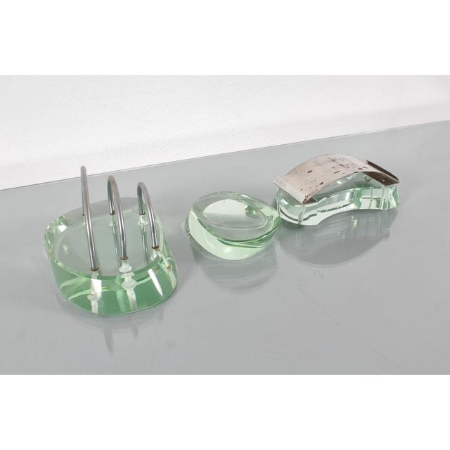 Very elegant desk set in thick Nile green cut glass, steel, and metal, consisting of a pad, envelope holder, and...