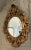 Antique 38.5" Gilt Carved Wood Oval Rococo Wall Mirror. Sturdy in frame. Minor ageing to mirror silver. Gilt losses as...
