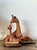 This charming vintage sculpture captures a heartwarming scene of a mother giraffe and her calf, masterfully crafted using...