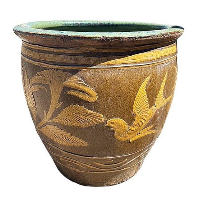 Late 19th-century Chinese art pottery century-egg jar adorned with beautifully hand-applied bird and fern motifs...