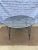 Grey Atomic Radar Garden, patio, poolside dining, cafe style table in wrought iron and metal mesh. The table has a...