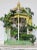 A charming hand painted wooden decorative bird cage. Architectural form, demilune shaped, surmounted by a turned finial,...
