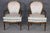 This refined pair of French style Louis XVI walnut armchairs, crafted in the mid-20th century, carries forward the...