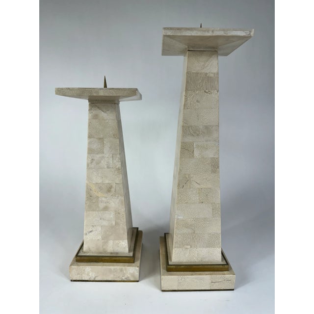 Pair of tessellated stone & brass candlesticks by Maitland Smith. Create depth with height from this stately pair. Tall is...