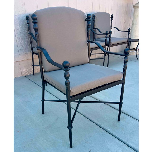 Wonderful outdoor MTD set, they have Black/bronze lightly textured powder coat finish. Top of table is Crema Marfil. Chair...
