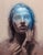Renewal by Josh Sorrell | Oil on Panel Portrait of a figure with a blue face and hands. For Sale