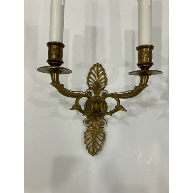 This pair of Empire style sconces date from the20’s They have been professionally rewired Solid brass Purchased at the...