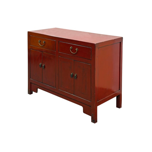 Embrace the stunning craftsmanship of this vintage Chinese red lacquer sideboard, a phenomenal statement piece built to...