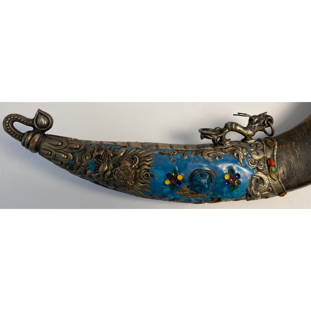 Tibetan Ceremonial Grigug Knife with Blue Enamel Mounts and Carved Horn Hilt, A striking antique Tibetan-style ritual...