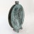 Ceramic vase with abstract decoration in relief, bronze green color, signed Rossi