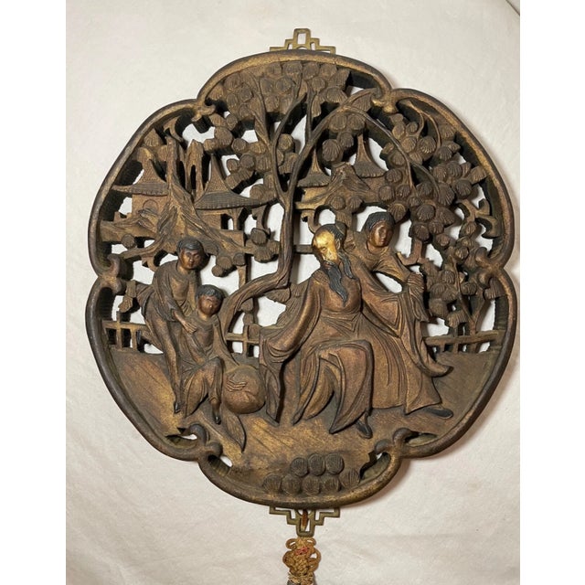 This antique Chinese sculptural wall panel is a stunning piece of art that will add a touch of elegance to any room....