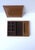 A leather jewelry box caddy with lid, circa mid-20th century. A tan camel/caramel colored leather jewelry box with a dark...