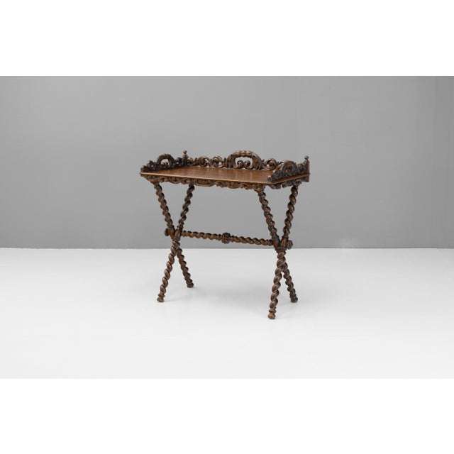 French tray table with carved gallery on folding base. Circa 1880.