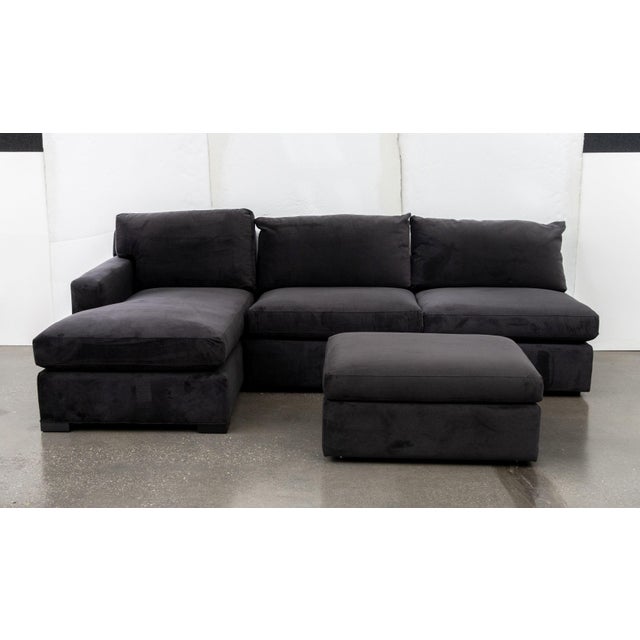 Modern Dark Velvet Upholstered Modular Sofa, in four pieces comprising: two banquettes, a chaise longue, and an ottoman,...