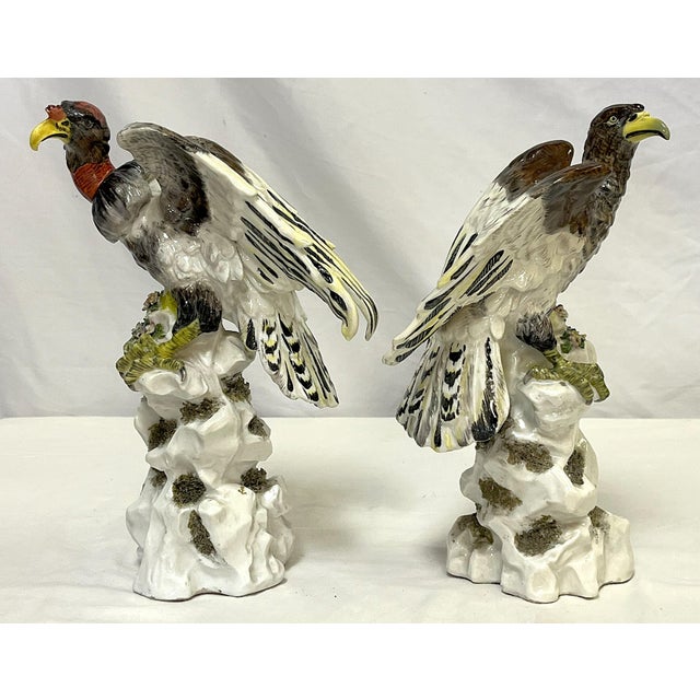 Austere pair of antique porcelain figures by Chelsea Porcelain from the 19th century. The coordinating pair of male and...