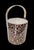 A nice vintage vinyl leopard ice bucket. The bucket features a lucite handle with a coated leopard vinyl design. It's a...