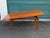 A very stylish and practical modern teak and teak veneer coffee / dining table with a unique mechanism. Hidden leaves and...