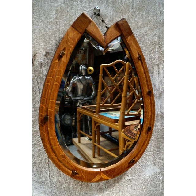 A Superb Georgian Oak Horseshoe Mirror, surrounded by an Oak frame, studded with Brass horseshoe tacks, still retains the...
